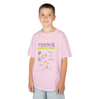 Young boy wearing a youth Gildan 5000B heavy cotton t-shirt in light pink with a Tennis text and graphic