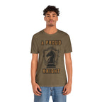 Man wearing a heather olive graphic T-shirt with a black chess knight design and the words A PROUD KNIGHT on the front.