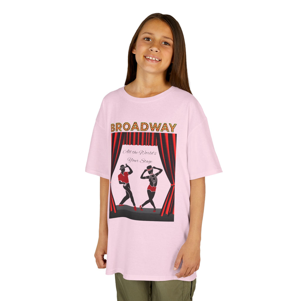 Young girl wearing a youth Gildan 5000B heavy cotton t-shirt in light pink with a Broadway text and graphic