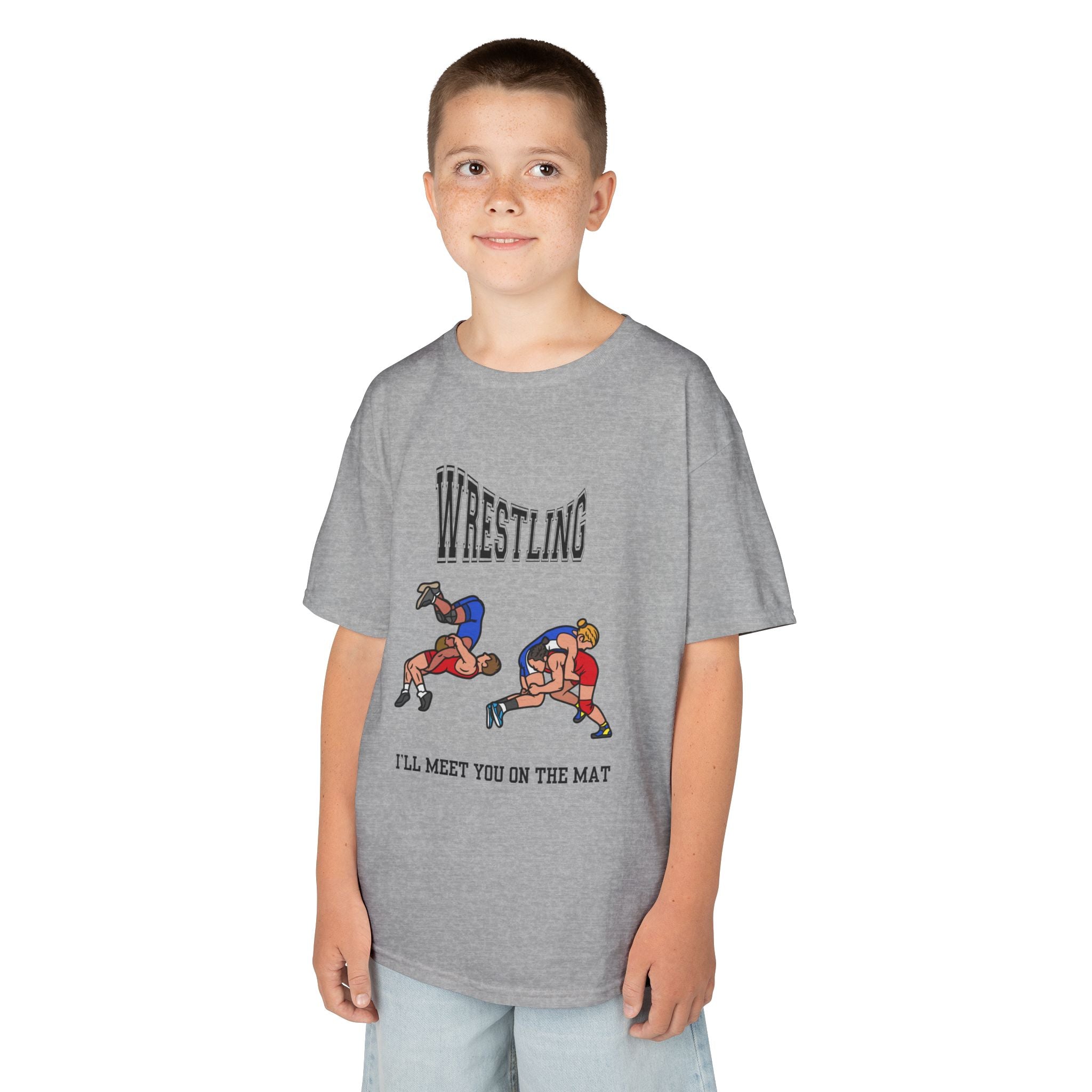 Young boy wearing a youth Gildan 5000B heavy cotton t-shirt in sport grey with a Wrestling text and graphic