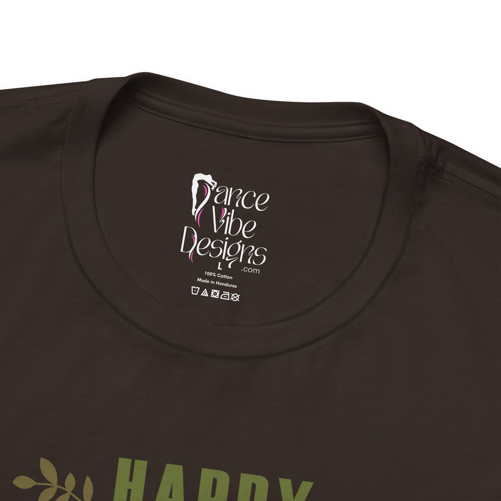 Close-up of a brown crewneck t-shirt showing the inner neck label with Dance Vibe Designs LLC printed in white.