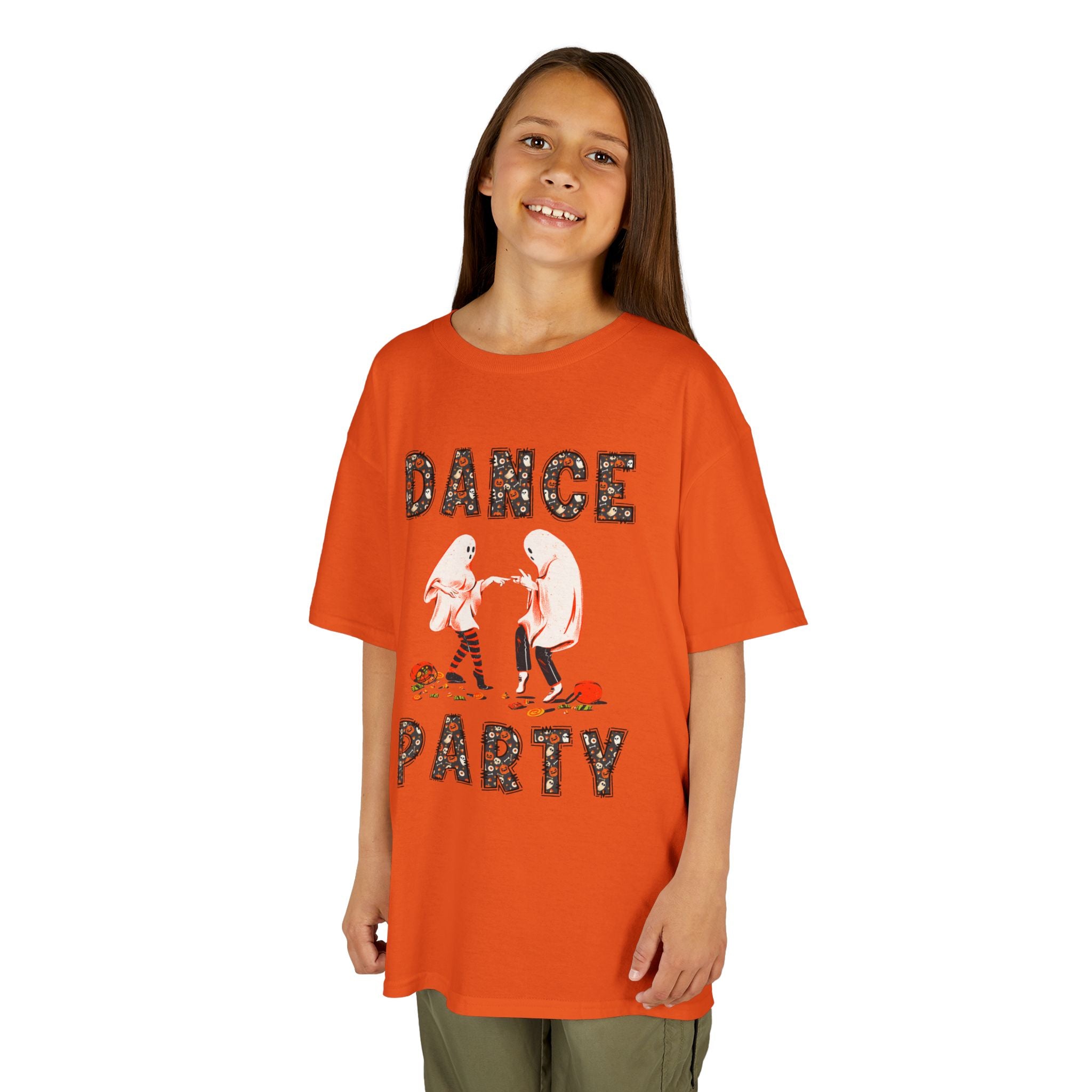 Young girl wearing a youth Gildan 5000B heavy cotton t-shirt in orange with a Halloween Dance Party theme