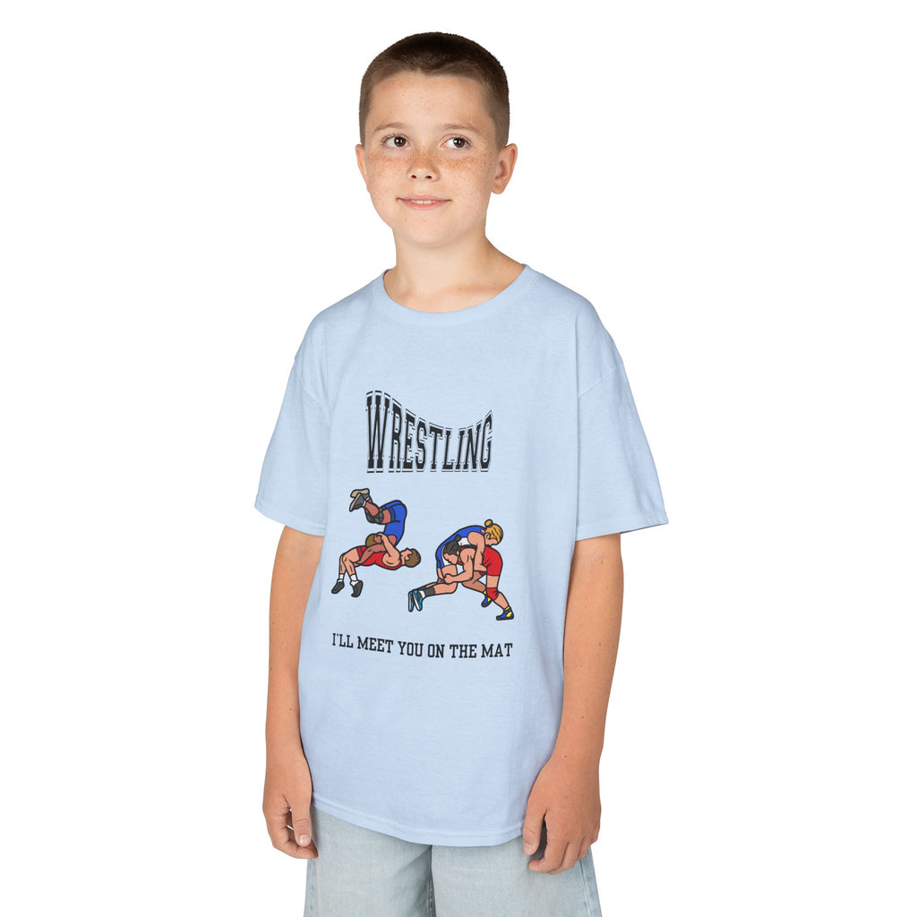 Young boy wearing a youth Gildan 5000B heavy cotton t-shirt in light blue with a Wrestling text and graphic