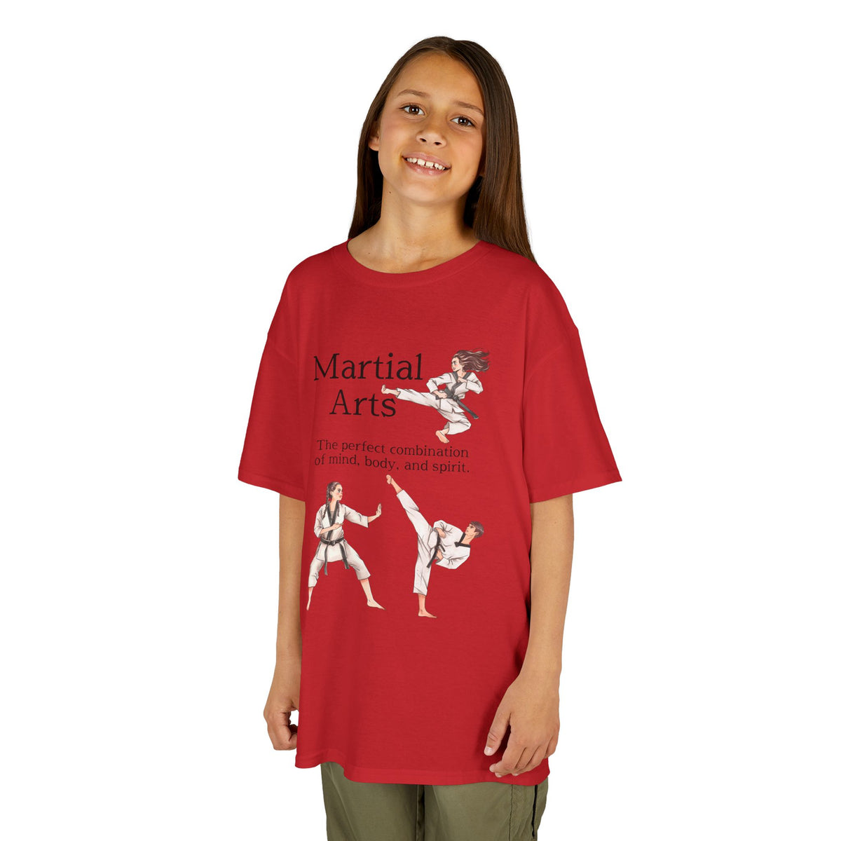 Young girl wearing a youth Gildan 5000B heavy cotton t-shirt in red with a Martial Arts text and graphic