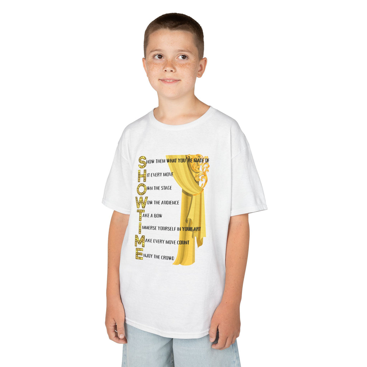 Young boy wearing a youth Gildan 5000B heavy cotton t-shirt in white with a Showtime text and graphic 