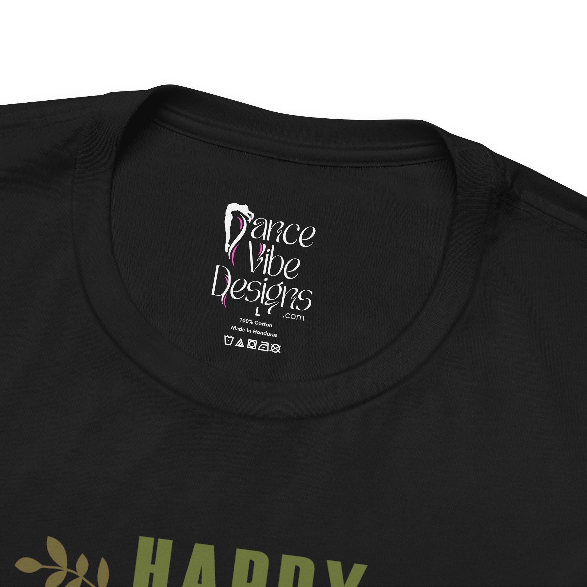 Close-up of a black crewneck t-shirt showing the inner neck label with Dance Vibe Designs LLC printed in white.
