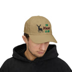 Man wearing a khaki cap with an embroidered deer silhouette and The Hunt Is On text.