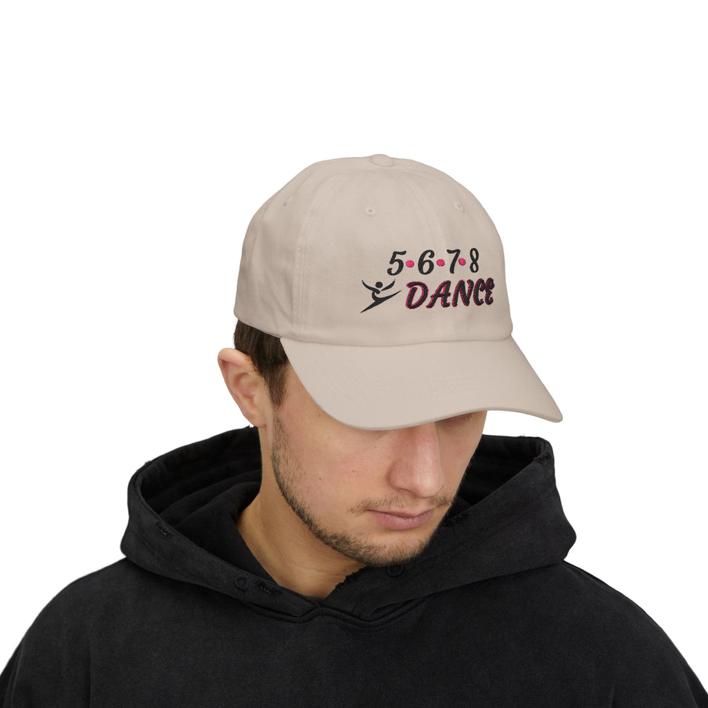 Man wearing a stone embroidered classic dad cap hat with a 5 6 7 8 Dance text and graphic