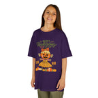 Young girl wearing a purple Thanksgiving t-shirt with a scarecrow ballerina design and a Happy Thanksgiving text.