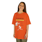 Young girl wearing a youth Gildan 5000B heavy cotton t-shirt in orange with a Tennis text and graphic