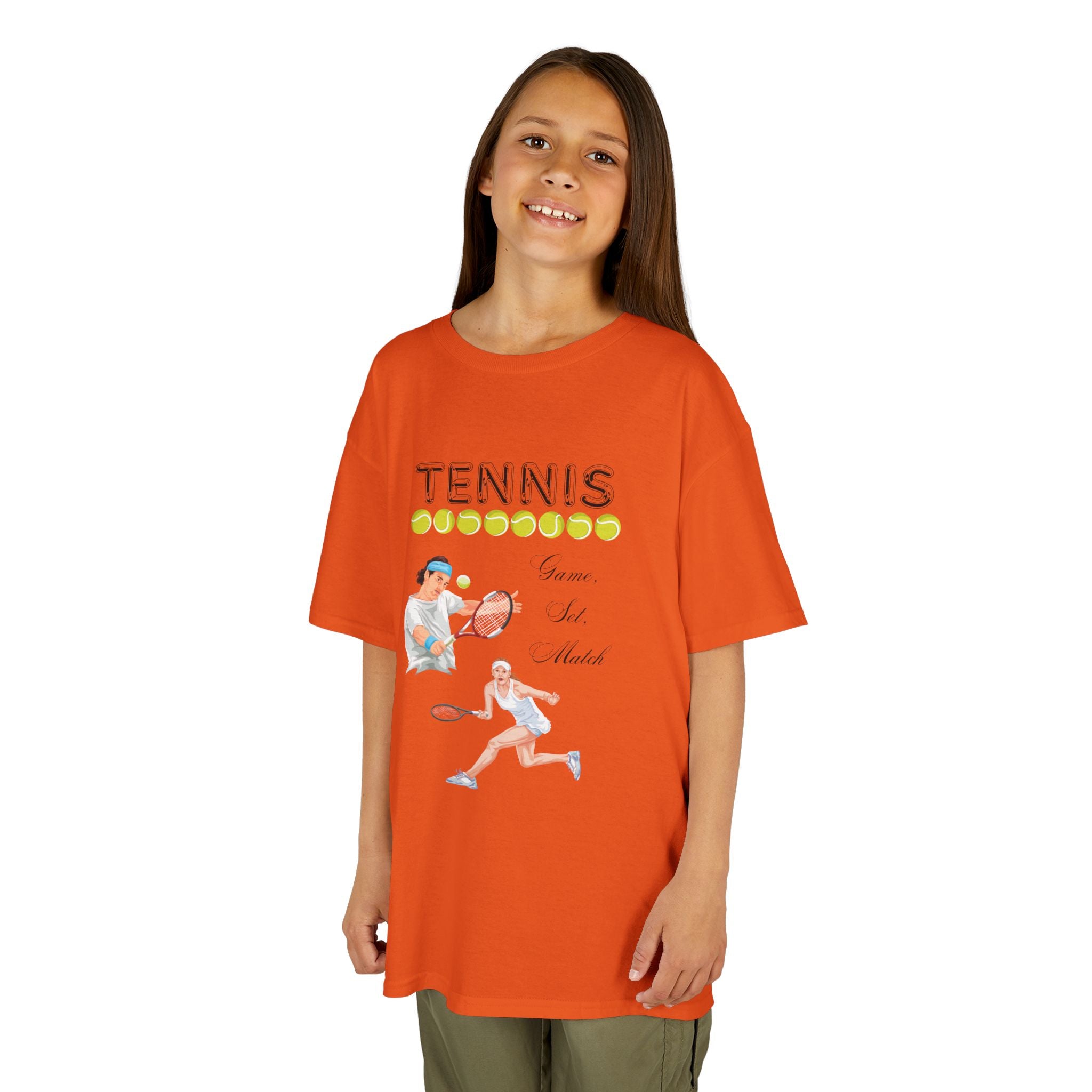 Young girl wearing a youth Gildan 5000B heavy cotton t-shirt in orange with a Tennis text and graphic
