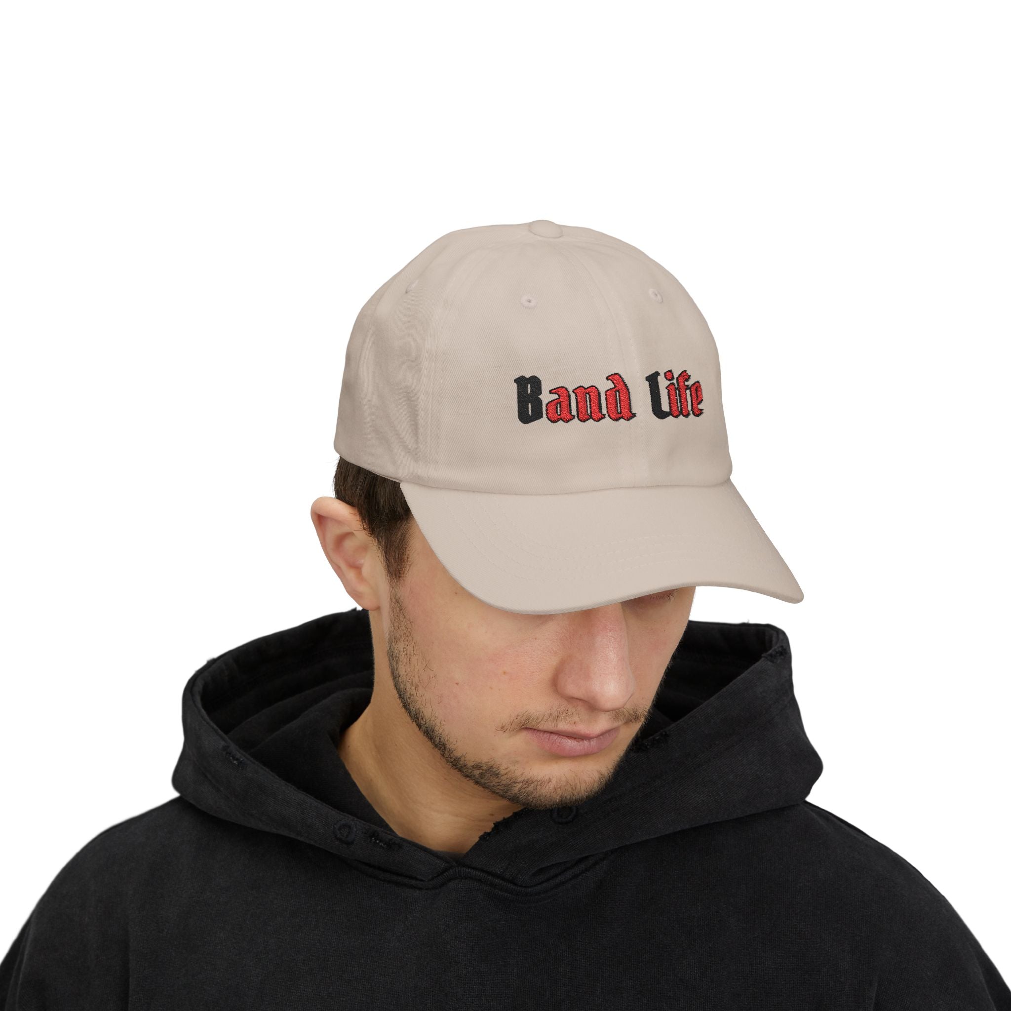Man wearing a stone embroidered classic dad cap hat with Band Life text