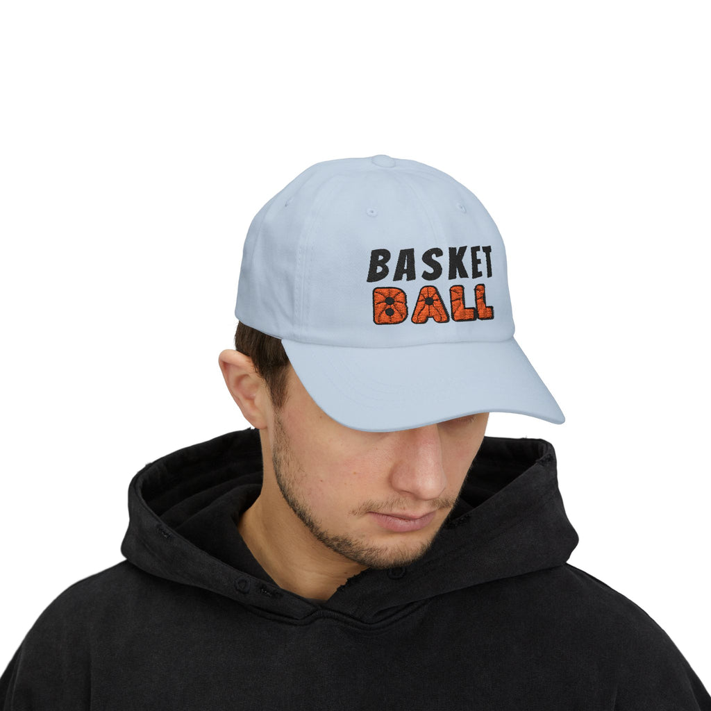 Man wearing a light blue embroidered classic dad cap hat with Basketball text and graphic