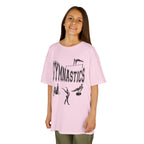 Young girl wearing a youth Gildan 5000B heavy cotton t-shirt in light pink with a gymnastics text and graphic