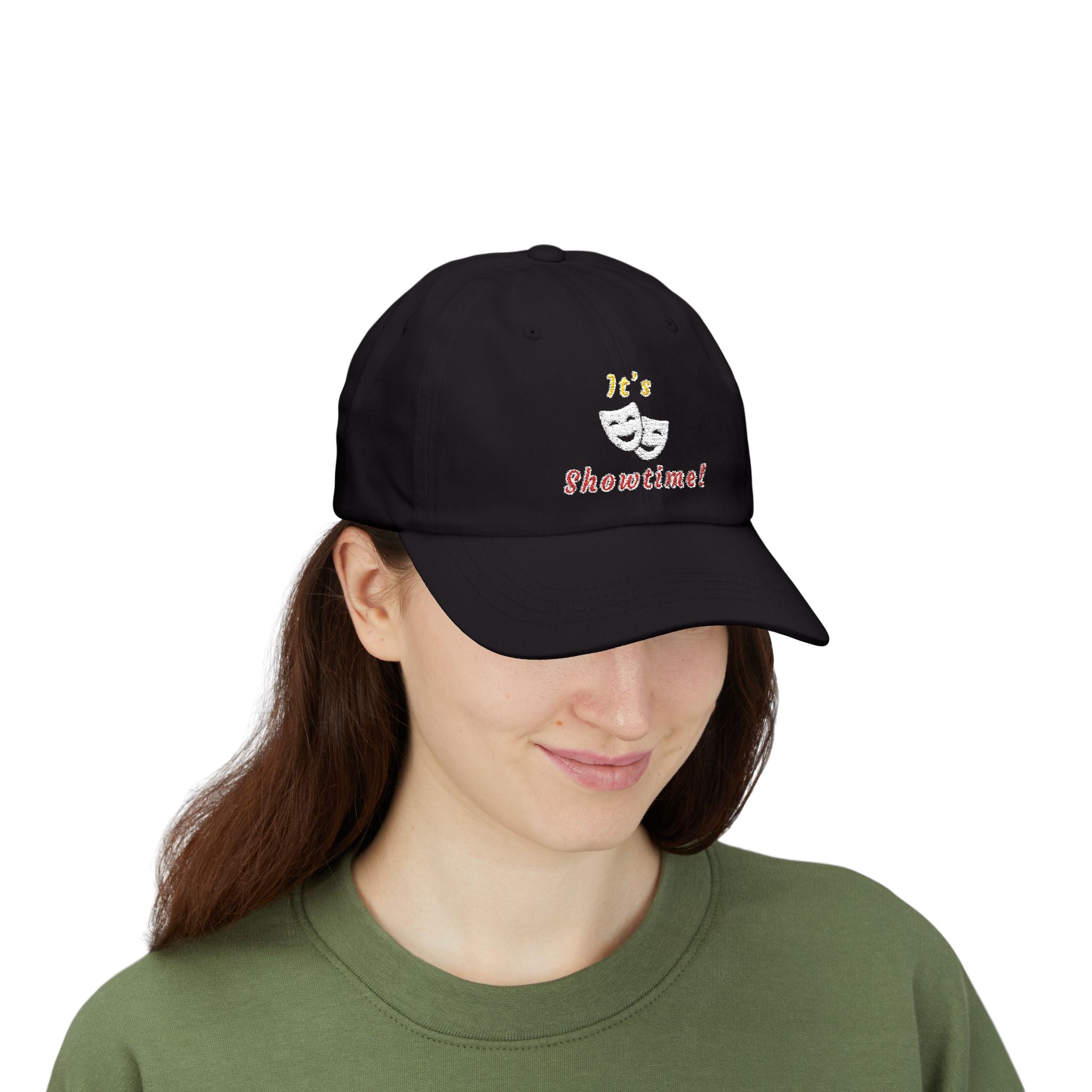 Woman wearing a black cap with an embroidered It's Showtime text and mask graphic.