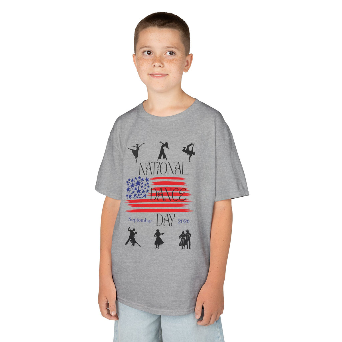 Young boy wearing a youth Gildan 5000B heavy cotton t-shirt in sport grey with a National Dance Day theme