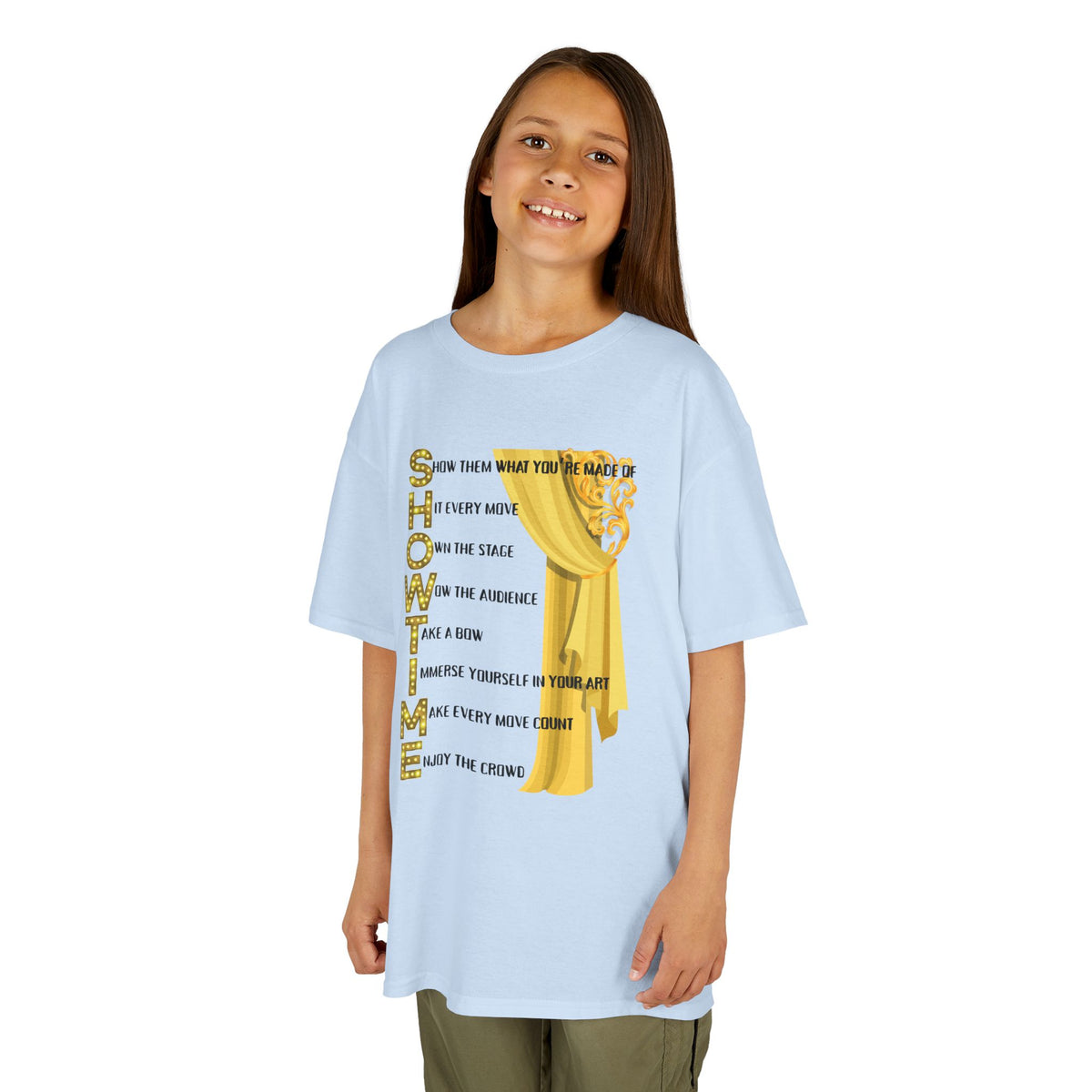 Young girl wearing a youth Gildan 5000B heavy cotton t-shirt in light blue with a Showtime text and graphic 