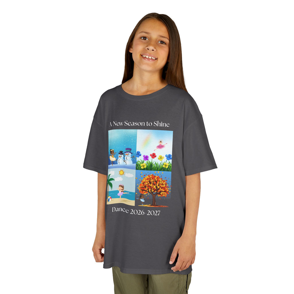 Young girl wearing a youth Gildan 5000B heavy cotton t-shirt in charcoal with an A New Season to Shine Dance 2026-2027 theme