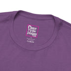 Close up view of a custom Dance Vibe Designs neck label shown over the t-shirt care instructions.