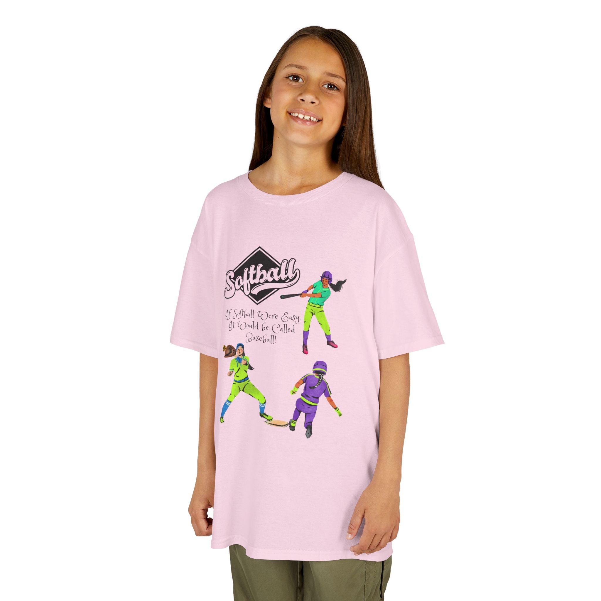 Young girl wearing a youth Gildan 5000B heavy cotton t-shirt in light pink with a Softball text and graphic