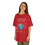 Young girl wearing a youth Gildan 5000B heavy cotton t-shirt in red with an International Dance Day theme 