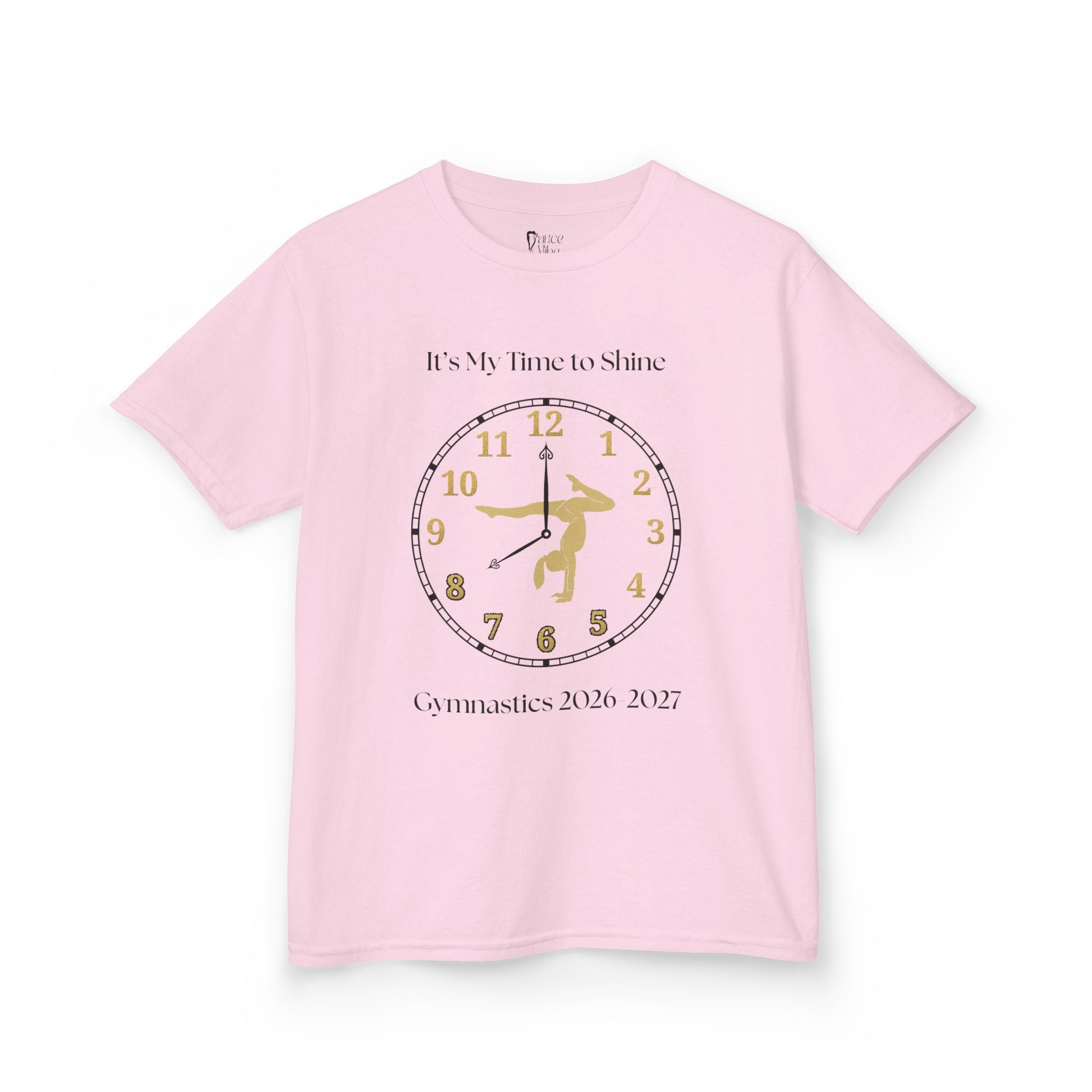 Front view of a youth Gildan 5000B heavy cotton t-shirt in light pink with an It's My Time to Shine Gymnastics 2026-2027 theme