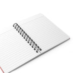A white lined spiral notebook with a silver metal coil binding, shown open on a clean white background.