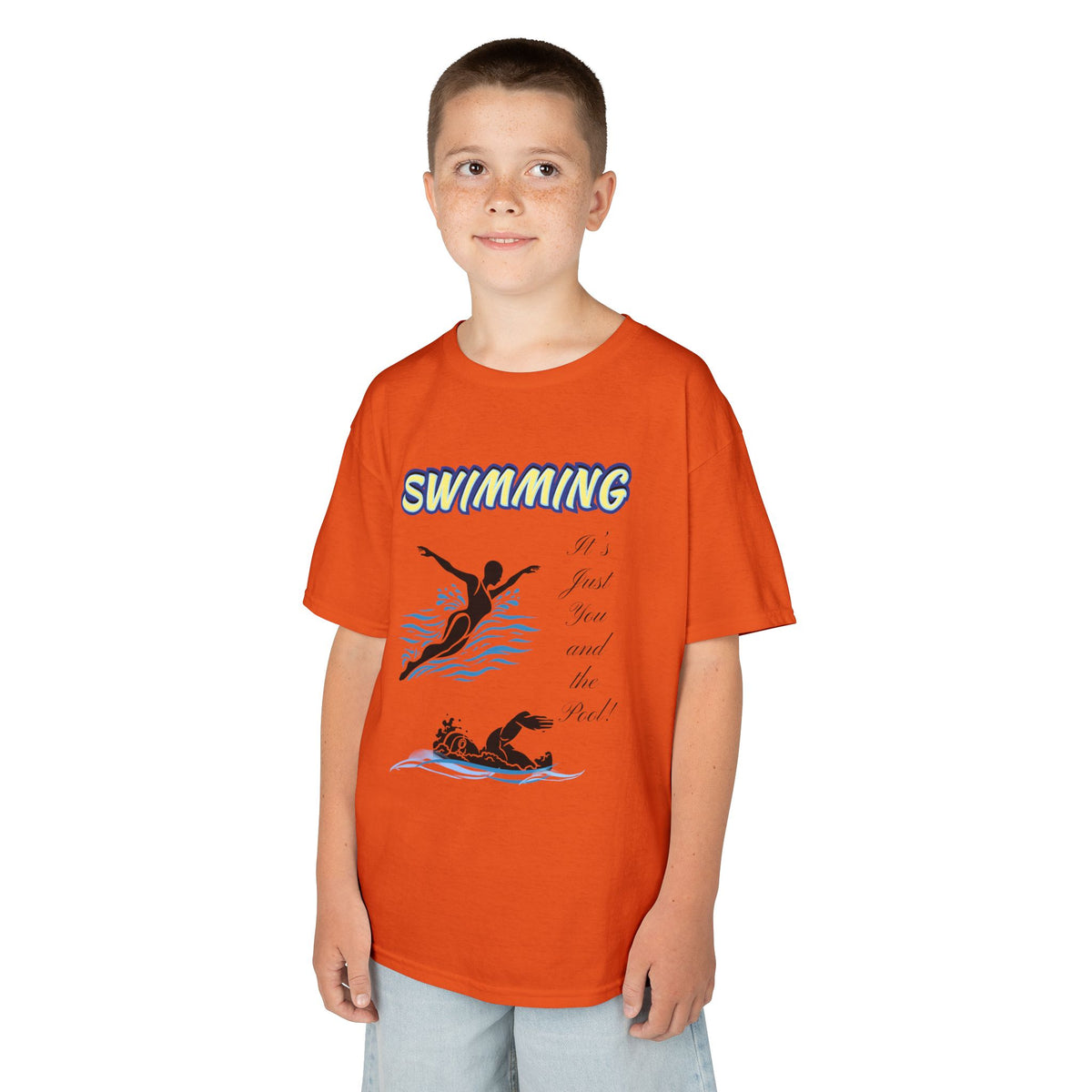 Young boy wearing a youth Gildan 5000B heavy cotton t-shirt in tennessee orange with a Swimming text and graphic