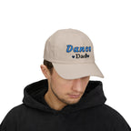 A man wearing a stone baseball cap with Dance Dad embroidered on the front.