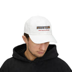 Man wearing a white embroidered classic dad cap hat with a Wrestling Meet me on the Mat text 