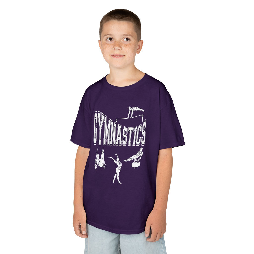 Young boy wearing a youth Gildan 5000B heavy cotton t-shirt in purple with a gymnastics text and graphic