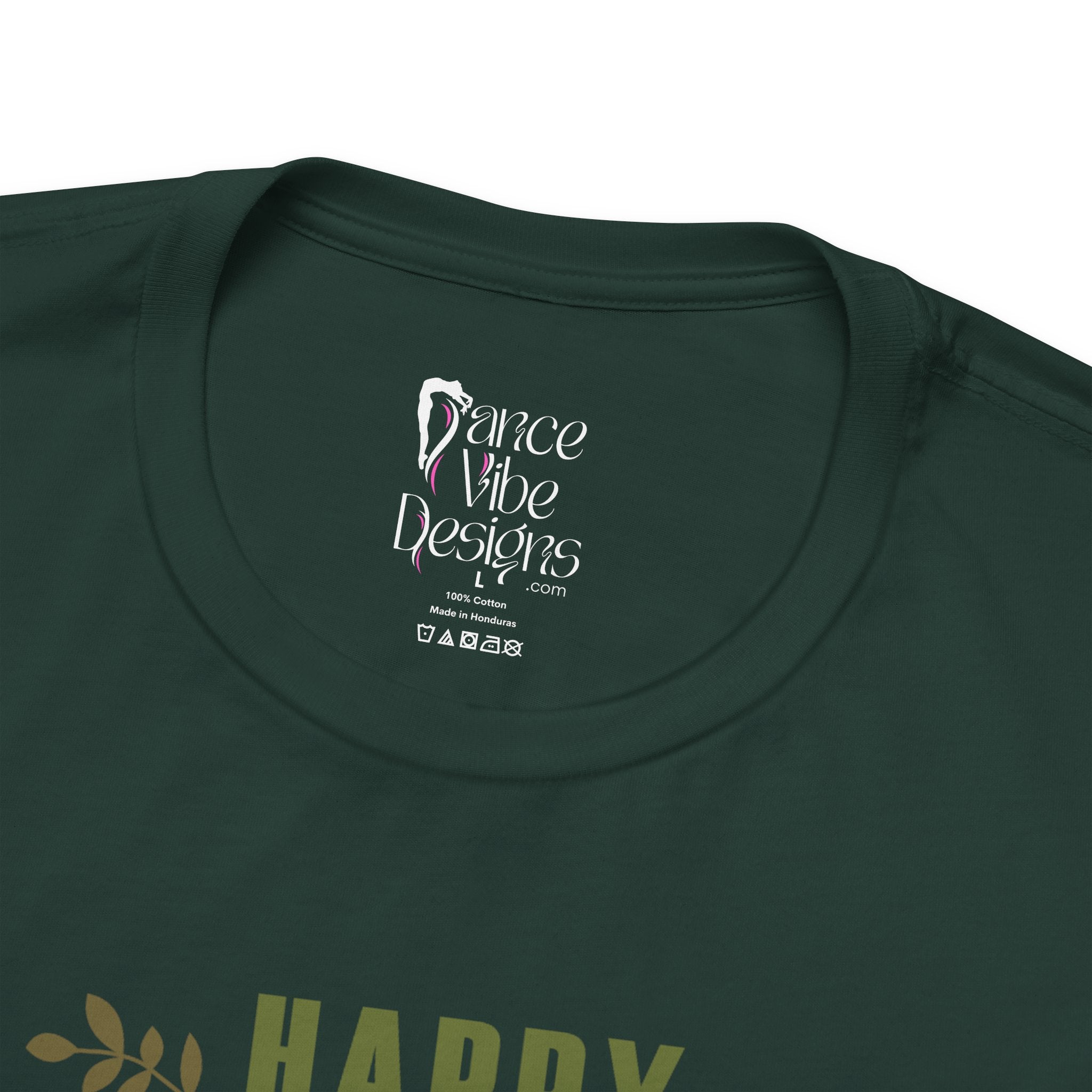 Close-up of a forest green crewneck t-shirt showing the inner neck label with Dance Vibe Designs LLC printed in white.
