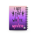 Back cover view of a spiral-bound notebook with a pink-to-purple gradient cover featuring the text 'I GOT THE WRITE MOVES' and black silhouette figures of ballet dancers.