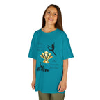 Young girl wearing a youth Gildan 5000B heavy cotton t-shirt in tropical blue with a Dance Competition theme
