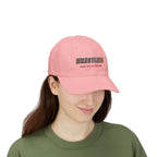 Woman wearing a pink embroidered classic dad cap hat with a Wrestling Meet me on the Mat text 
