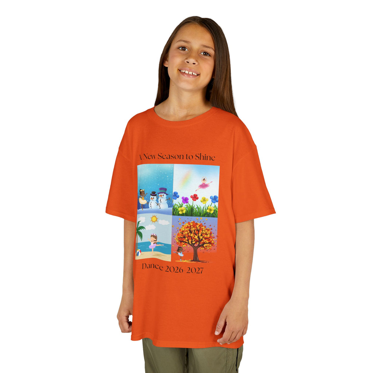Young girl wearing a youth Gildan 5000B heavy cotton t-shirt in orange with an A New Season to Shine Dance 2026-2027 theme