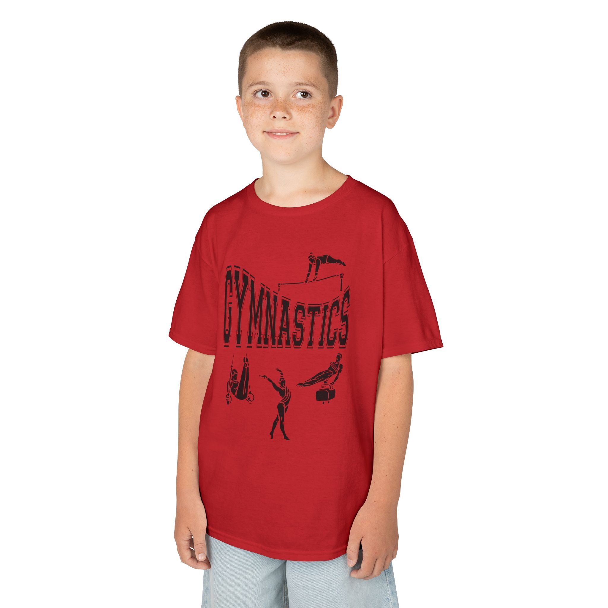 Young boy wearing a youth Gildan 5000B heavy cotton t-shirt in red with a gymnastics text and graphic