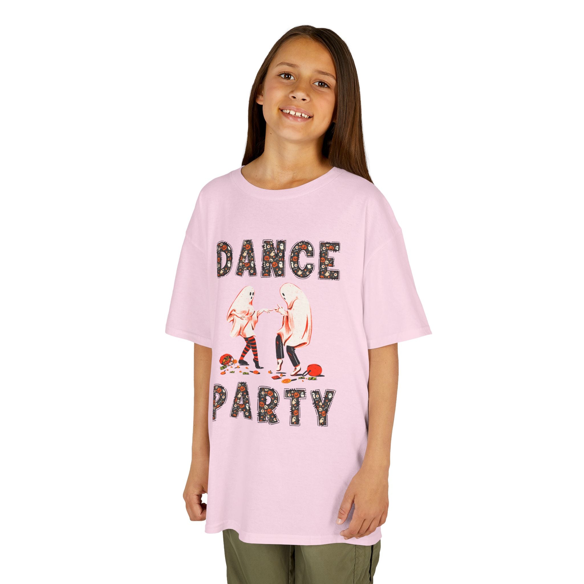 Young girl wearing a youth Gildan 5000B heavy cotton t-shirt in light pink with a Halloween Dance Party theme