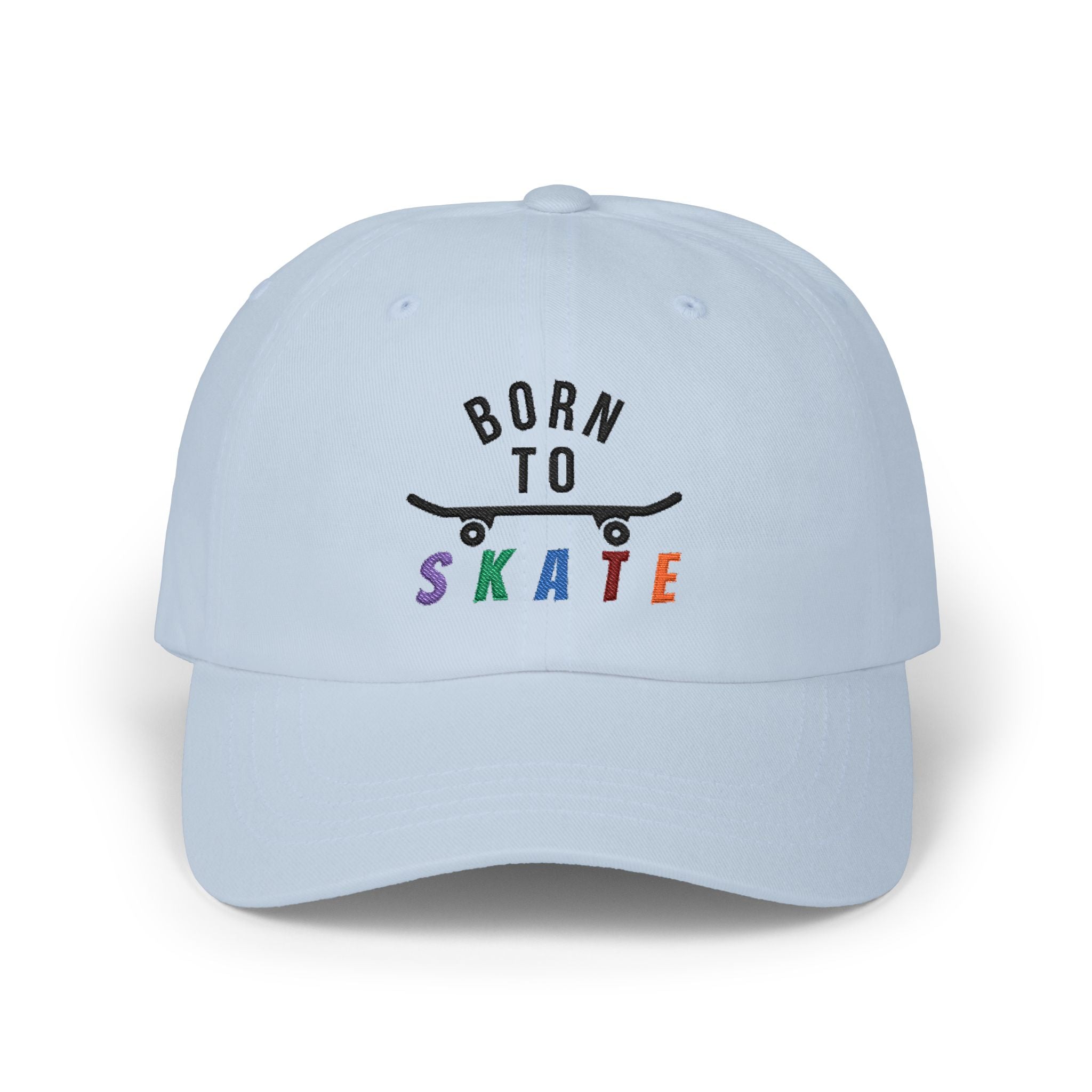 A light blue baseball cap featuring a graphic on the front that reads BORN TO SKATE with a black skateboard silhouette and colorful lettering for SKATE.