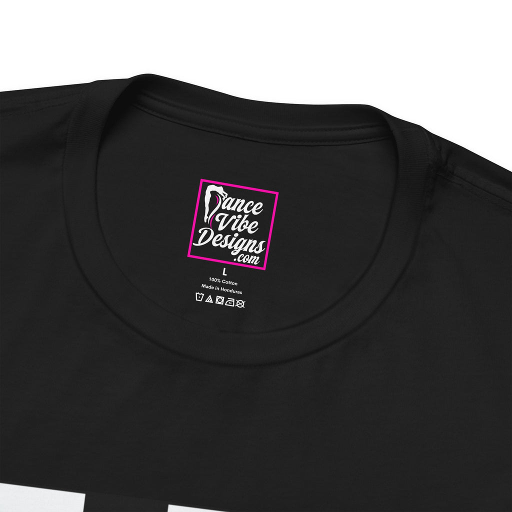 Close up view of a custom Dance Vibe Designs neck label shown above the t-shirt care instructions.