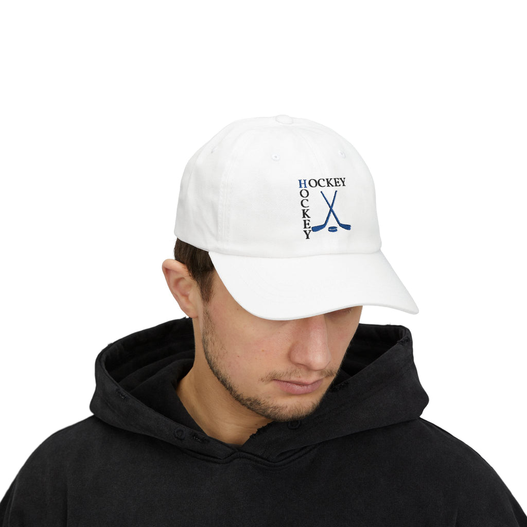 Man wearing a white embroidered classic dad cap hat with a Hockey text and graphic