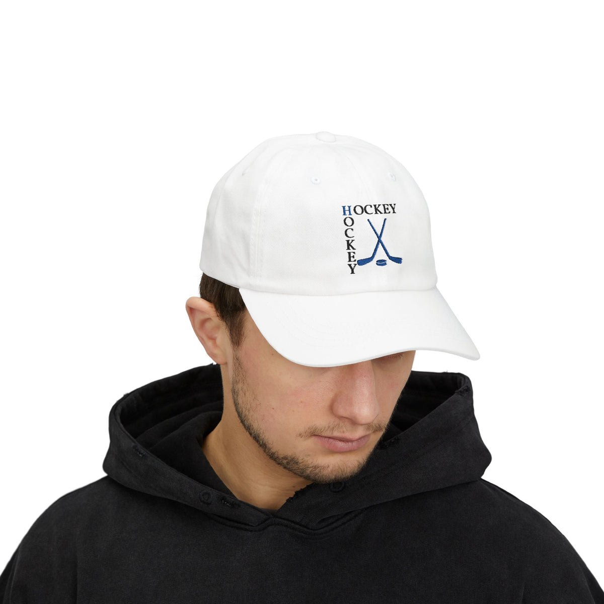 Man wearing a white embroidered classic dad cap hat with a Hockey text and graphic