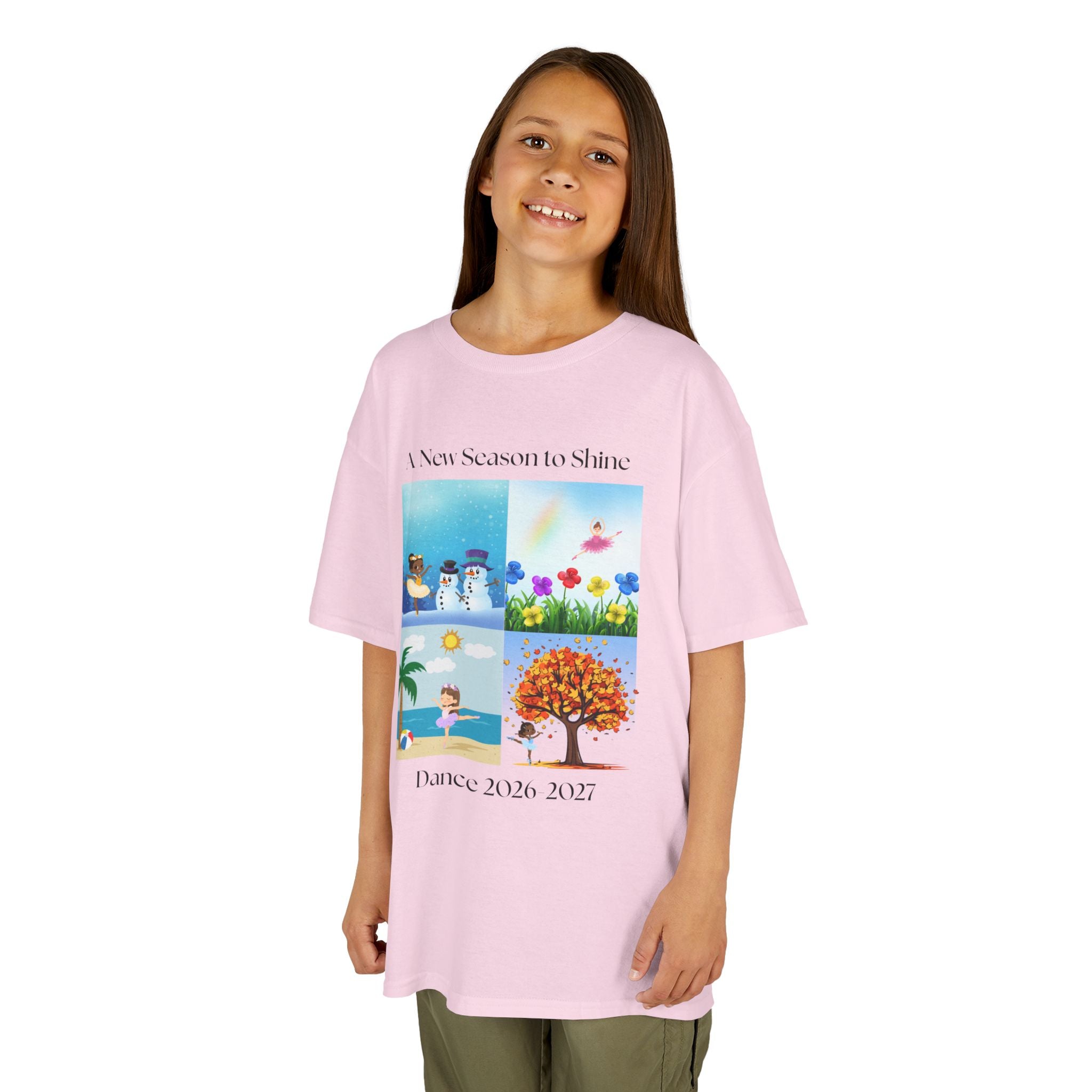 Young girl wearing a youth Gildan 5000B heavy cotton t-shirt in light pink with an A New Season to Shine Dance 2026-2027 theme