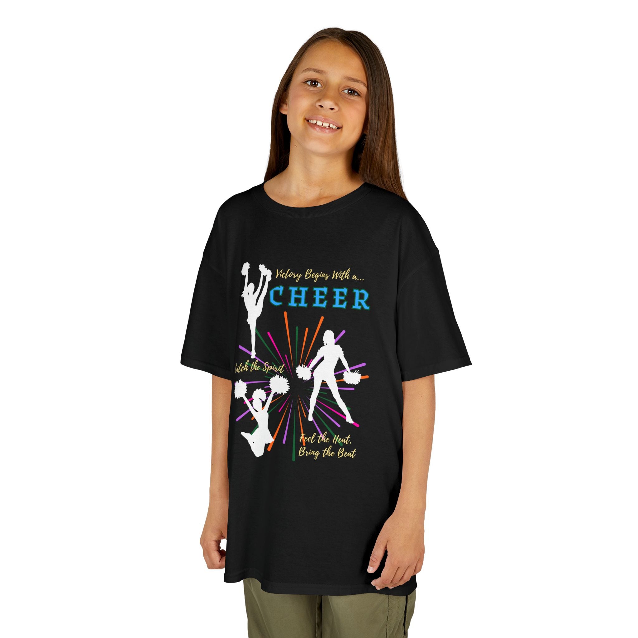 Young girl wearing a youth Gildan 5000B heavy cotton t-shirt in black with a Cheer Team design
