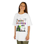 A young girl wearing a white short-sleeve crewneck t-shirt featuring a colorful Happy Halloween graphic on the front, complete with a haunted house, witch, and spiderweb.