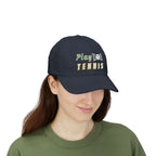 Woman wearing a navy baseball cap featuring the embroidered text Play TENNIS on the front.