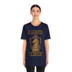 Woman wearing a navy graphic T-shirt with a gold chess knight design and the words A PROUD KNIGHT on the front.