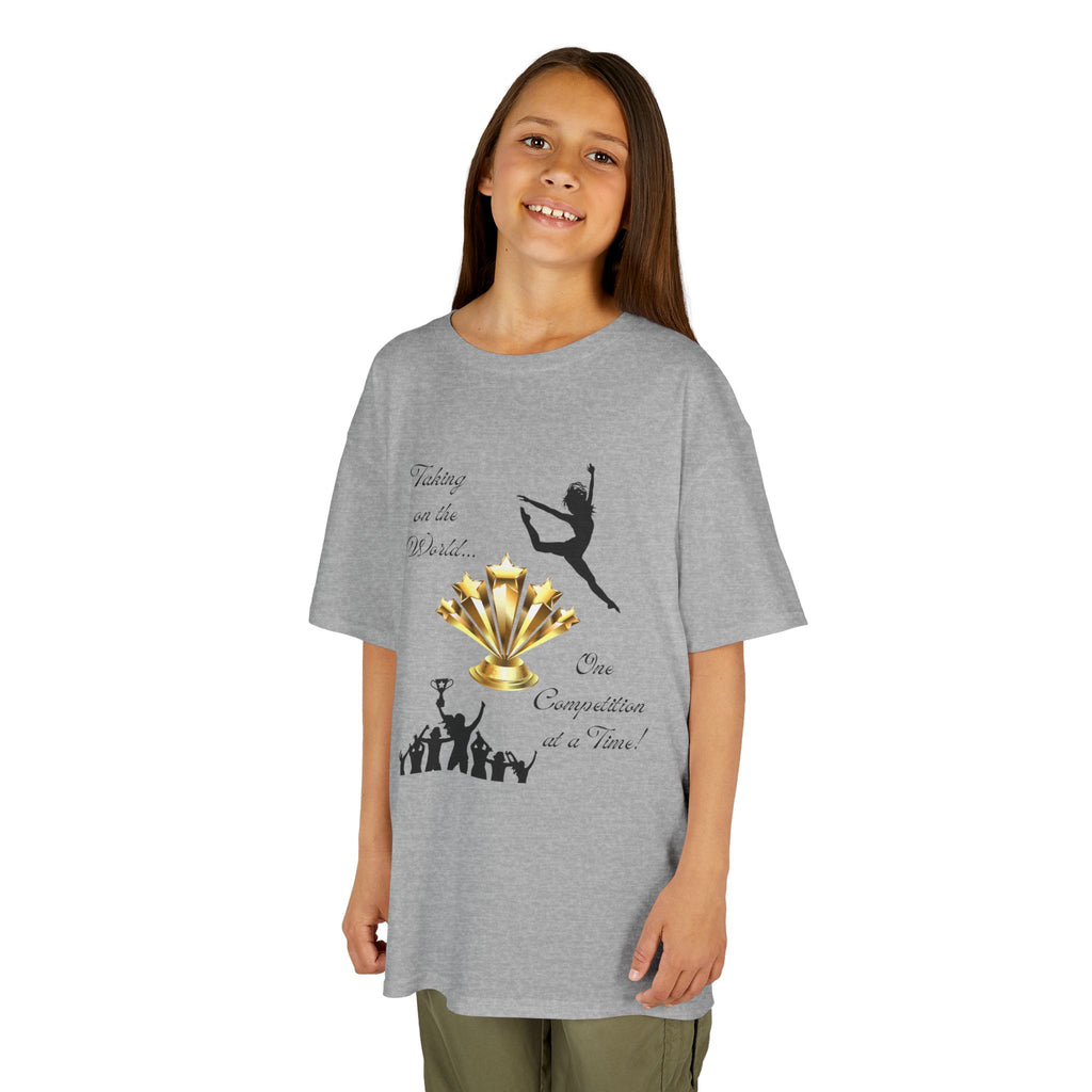 Young girl wearing a youth Gildan 5000B heavy cotton t-shirt in sport grey with a Dance Competition theme