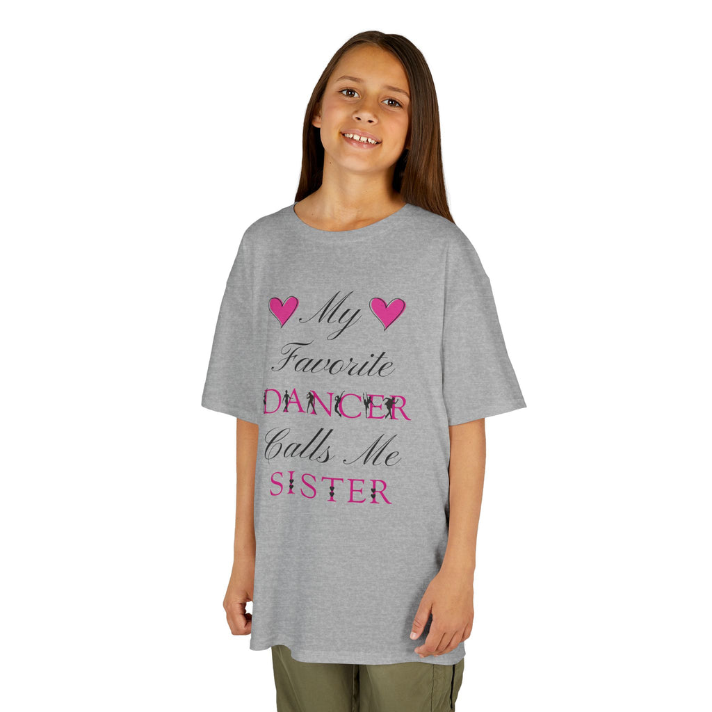 Young girl wearing a sport grey short-sleeve t-shirt with a graphic text print on the front that reads My Favorite Dancer Calls Me Sister.