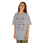 Young girl wearing a sport grey short-sleeve t-shirt with a graphic text print on the front that reads My Favorite Dancer Calls Me Sister.